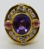 18kt yellow gold ring with center amethyst stone and 21 accent stones, size 7 1/2