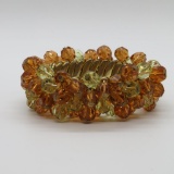 Expandable bracelet with glass beads, citrine and peach colored glass beads