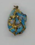Turquoise nugget pendant with gold veining, 1 1/4