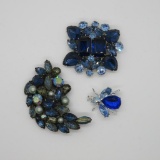 Three costume jewelry pins, blue rhinestones and pearlized beads