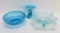 Three blue glass bowls, in style of Fenton