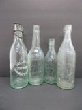 Four Val Blatz bottles, clear embossed