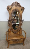 Lovely Heavily carved lift top hall tree with mirror