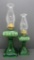 Two vintage green glass oil lamps with etched design, 10