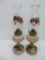 Two strawberry painted oil lamps, 16