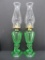 Pair of green vaseline glass dolphin base oil lamps, 10