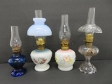 Four miniature oil lamps, 8