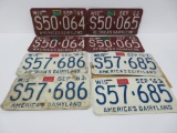Four sets of license plates, 1963 and 1965, matched sets