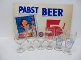 Six beer glasses and cardboard advertising 5 cent sign