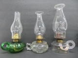 Three vintage fingertip oil lamps, clear and green, 10