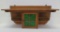 Oak shelf with green slag glass storage compartment, 24 1/2