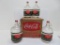 Four one Gallon Coke syrup glass bottles in cardboard carton