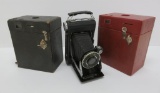 Three Kodak cameras, box and folding