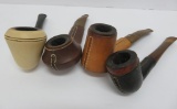 Four vintage leather wrapped and clay pipes, 5