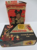 Two vintage Mickey Mouse Club movie projectors with movies in original boxes