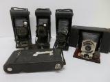 Five folding cameras, Kodak and Ansco, as found