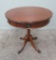 Round mahogany table with drawer, metal cap feet