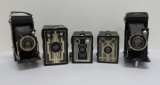 Five Deco styled vintage cameras, box and folding
