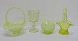 Four pieces of vasoline glass, baskets, stem and rose bowl