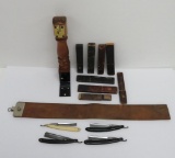 Four vintage folding razors, leather sharpening strap, wall mount and cases with advertising