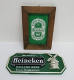 Two vintage Heineken signs, 12