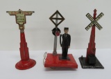 Three pre war Lionel accessories, two signs and Flagman #1045, 7