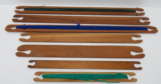 Seven wooden stick shuttles, 15 1/2" to 21"