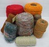 8 cones of nubby loop and red brick, yarn warp