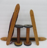 Three wooden shuttles and two wooden spools
