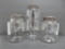 Early glass pontil jars, hand blown with metal covers, two 8