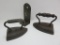 Two cast iron flat irons and tin candle holder, wall mount