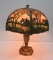 Slag glass lamp with metal overlay, scenic with cabin, 23