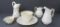 Six pieces of Belleek, small pitchers and cup and saucer