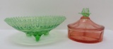 Two pieces of glassware, pink and green, depression era