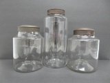 Early glass pontil jars, hand blown with metal covers, two 8