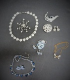 Rhinestone and colored stone jewelry lot, necklace, pins, and demi parure