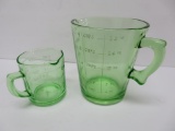 Two green depression glass measuring cups, one cup and 4 cup
