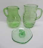 Green Depression glass pitchers and candy dish