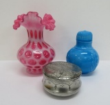 Cranberry glass coin dot vase, blue milk glass bottle, and metal trinket box