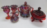 Four pieces of red carnival glass and ruby sea shell candy container