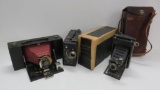 Two Kodak folding cameras and Cine Kodak Model B movie camera