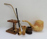 Two long pipes, corn cob pipe, pipe stands and humidors