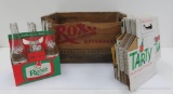 Distressed Roxo wooden box, six pack Roxo soda bottles and 24 carrier cartons