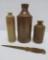 Three stoneware ink bottles and brass letter opener