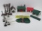 Plasticville train lay out buildings and track accessories, about 26 pieces