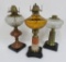 Three vintage oil lamps, 14