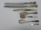 Seven pieces of ornate flatware, serving pieces, some marked sterling