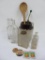 Assorted bottles, wooden spoon, stoneware jar base, and matchbooks