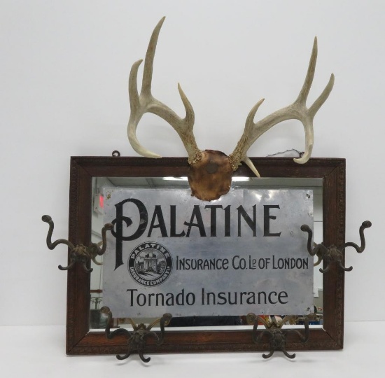 Palantine Insurance Co advertising mirror with coat hooks and antlers
