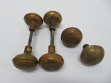 Six ornate brass doorknobs